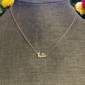 Gold tone cursive hello necklace